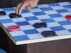kids playing checkers at camp
